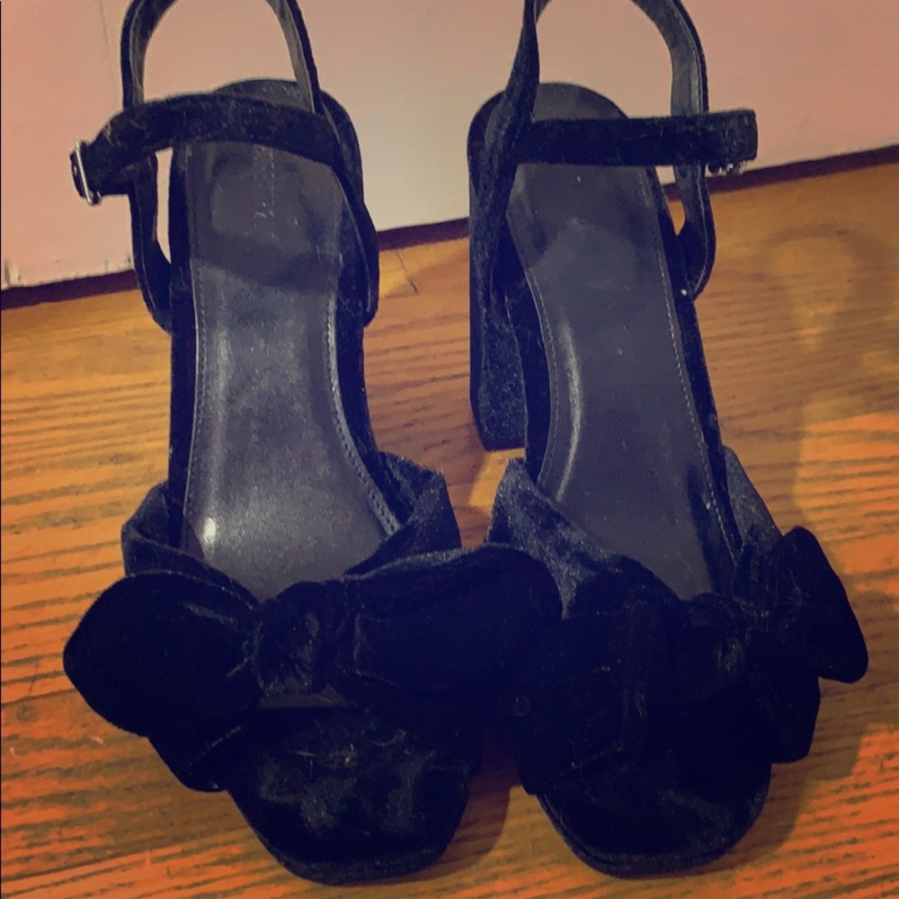 Black faux velvet heels with bow.